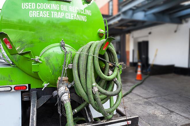 pumping out excess grease and waste from a restaurant's trap in Jensen Beach, FL